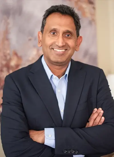 Professor Prasanna Sooriakumaran, robotic prostate surgeon in London, arms folded